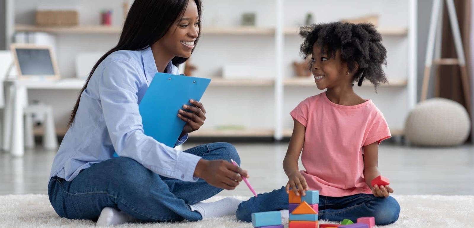 Female BCBA working with a young girl at Autism Learning Collaborative